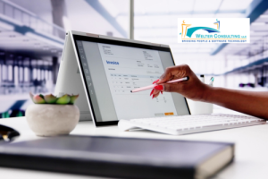person at desk using accounting software