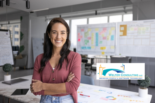 woman standing in front of table with several information boards behind it. Grant Management